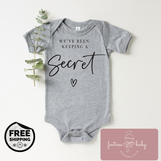 We've Been Keeping A Secret Pregnancy Announcement Onesie